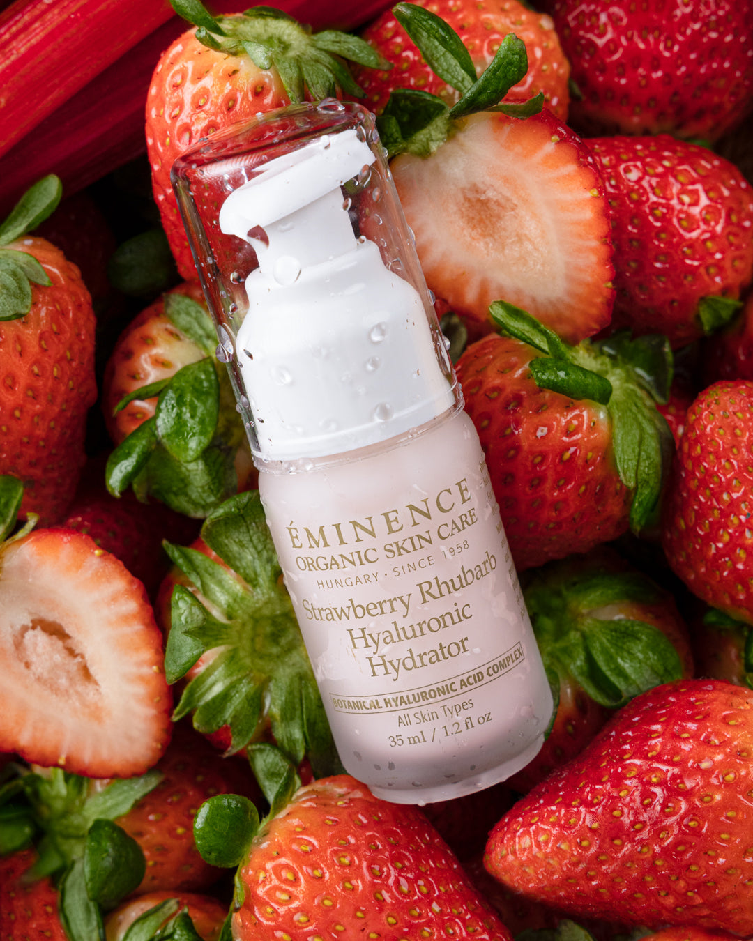 facial moisturizer placed on fresh strawberries