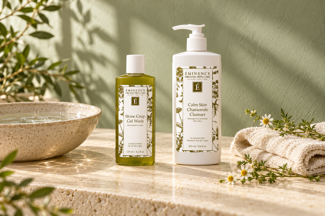 Éminence Stone Crop Gel Wash and Calm Skin Chamomile Cleanser beside a water bowl and cream washcloth.