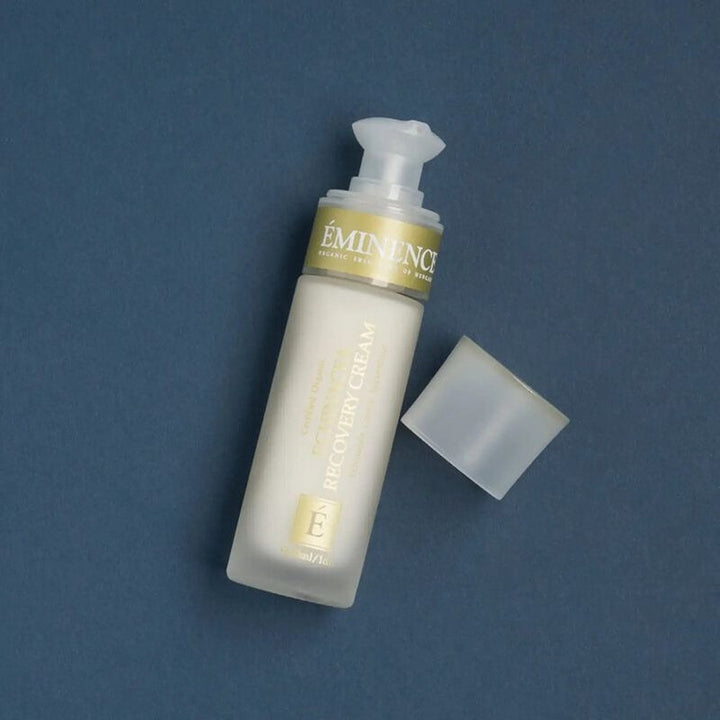 Eminence skincare bottle with pump on a blue background